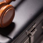 gavel and brief case, commercial litigation theme