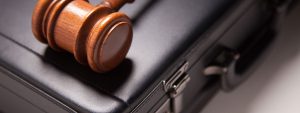 gavel and brief case, commercial litigation theme