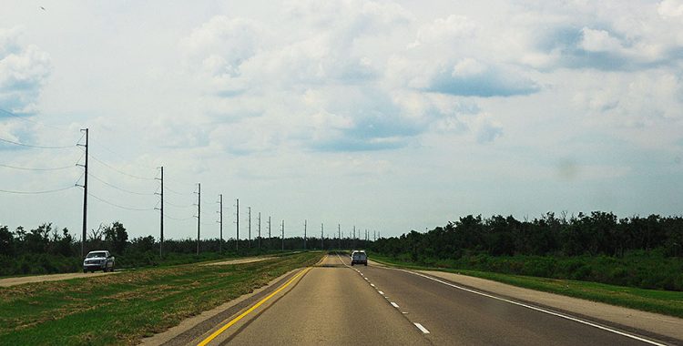 motor vehicles driving down an open road